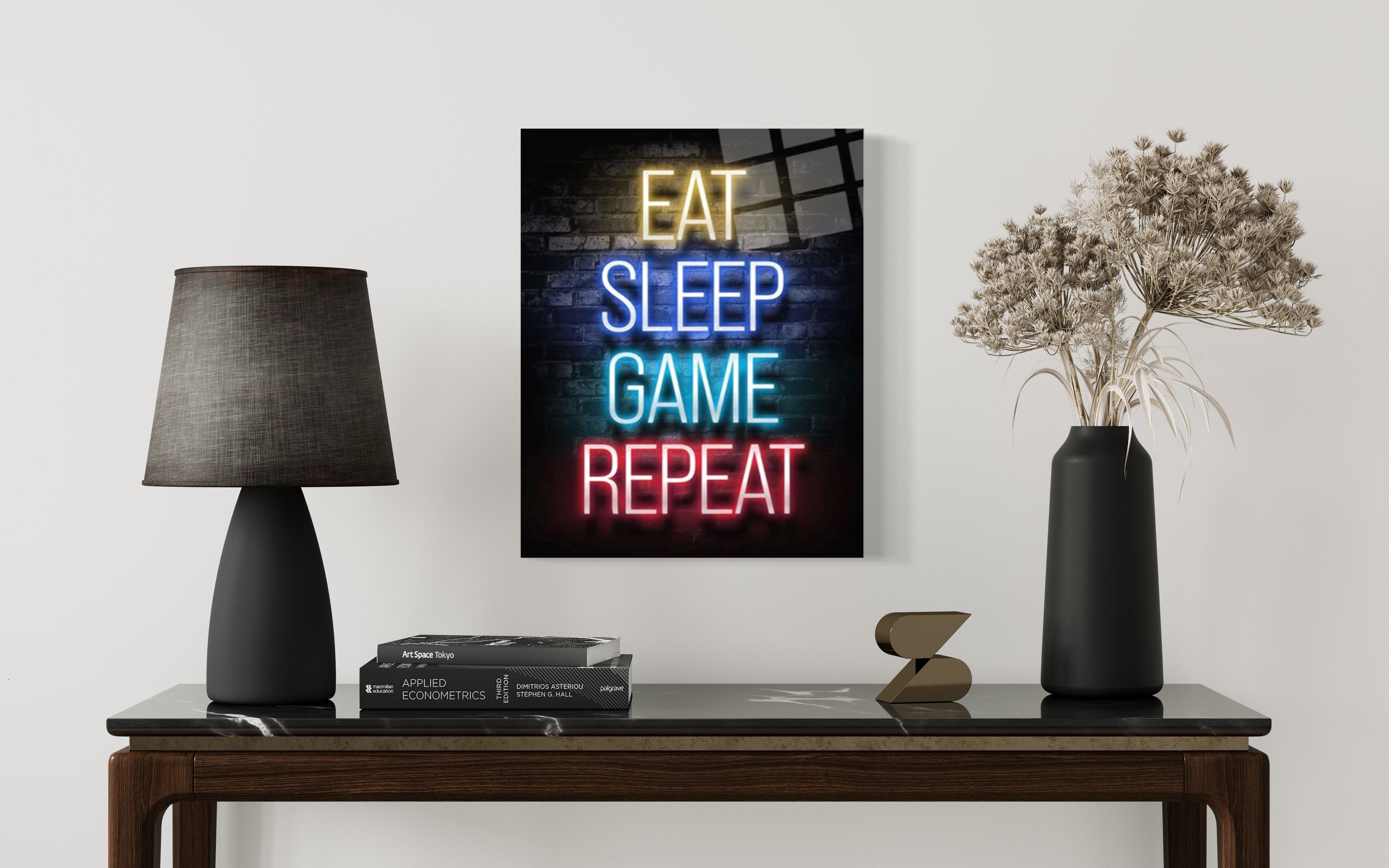 Wandkunst „Eat Sleep Game Repeat“.